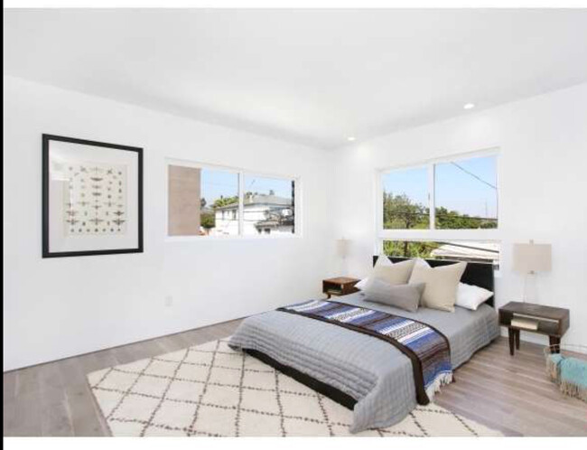 Upstairs bedroom1. End unit, so this room has windows on both corner walls. Lots of natural light. - 2730 Auburn Street