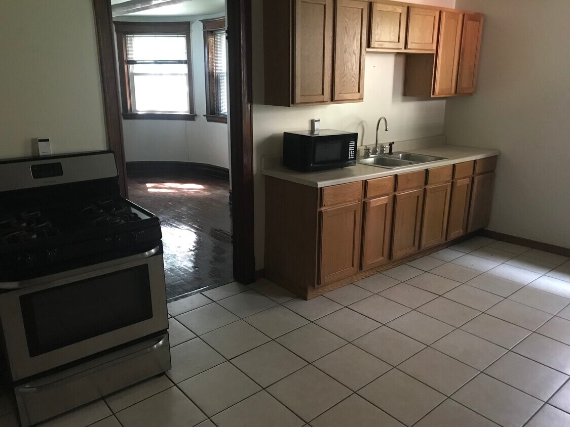 Large kitchen, stove, microwave, fridge - 2338 S Marshall Blvd