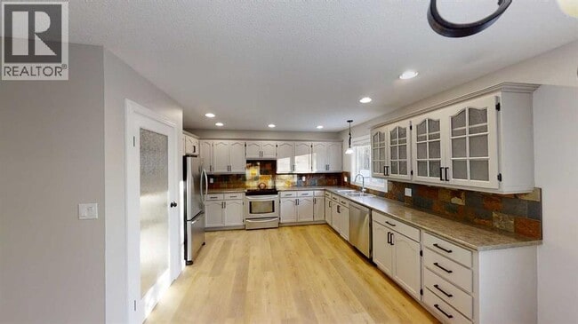 Photo du bâtiment - 9533-9563 63 Ave