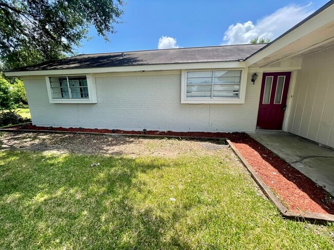 Beautiful grey home with modern red door. - 2623 4th Ave N