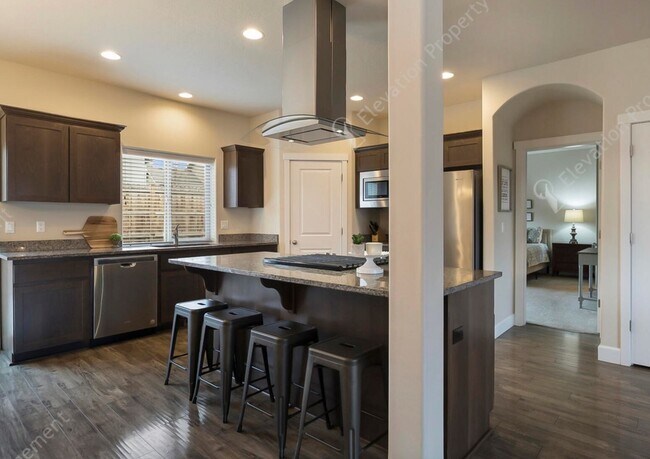 Building Photo - Spacious 4-Bedroom Home with Main Floor Pr...