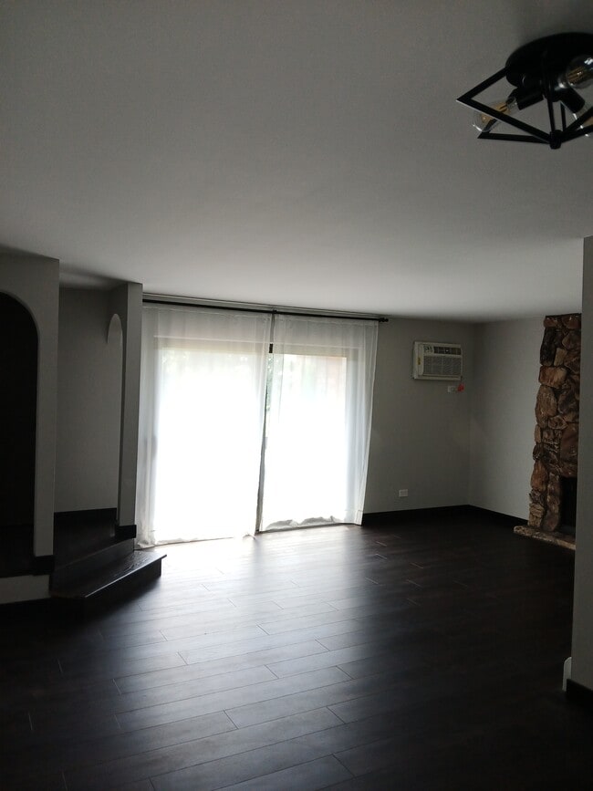 Living room with air-conditioning unit - 15820 Orlan Brook Dr