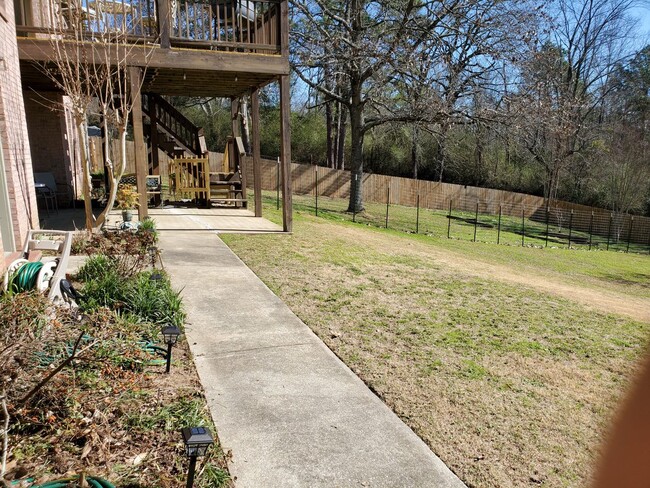Gate opens to large fenced-in back yard, divided in half. Near side is for tenant's use. - 4503 S Shades Crest Rd