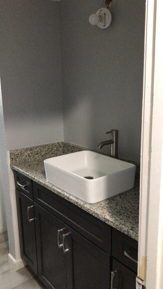 New modern style vessel sink, with granite countertop and cabinets - 10335 Glenkirk Dr