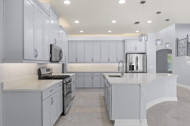 Building Photo - Spacious 6-Bedroom Home Near Lake Nona | 3-Car Garage + Tesla Charger