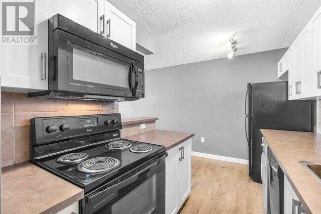 Photo du bâtiment - 110-124 24 Ave SW