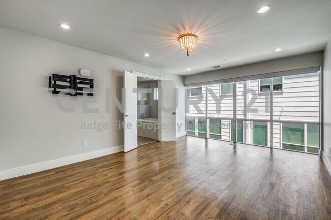 Building Photo - One-Of-A-Kind 4-Story 2/2.5.5/2 Townhome R...
