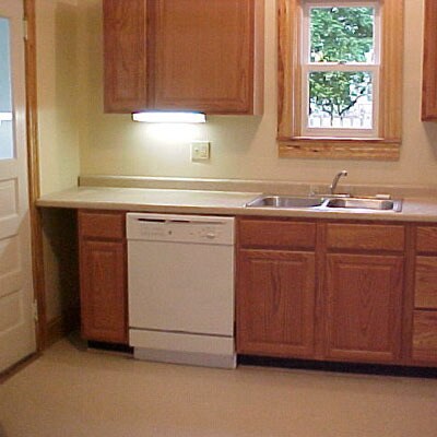 Kitchen with outside entry door on left. - 512 S Center St