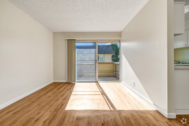 Living room view to deck. - Inglewood Oaks Apartments