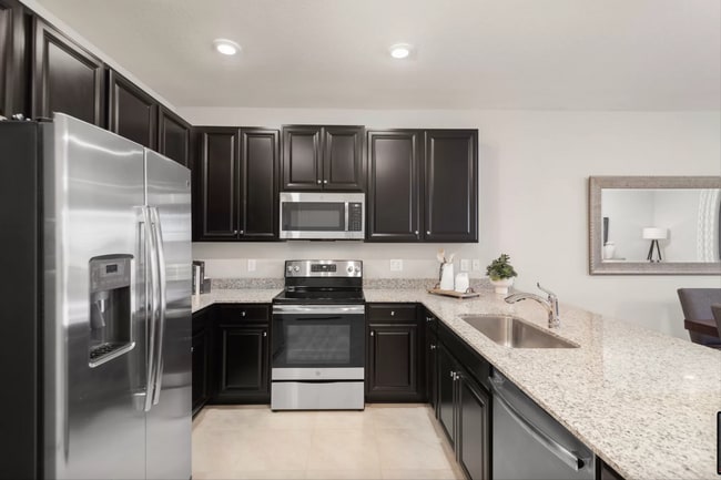 Kitchen with stainless steel appliances - 10806 SW 235th Ln