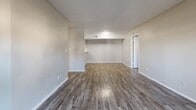 This 790 square foot apartment in Irving, TX offers a modern and efficient living space. The single-story layout includes two bedrooms and two bathrooms, with the primary bedroom boasting a generous 160 square feet. Throughout the apartment, sleek wood-look flooring creates a cohesive and contemporary aesthetic.

The open-concept design combines the kitchen and living area, maximizing the use of space. The kitchen features white cabinetry, granite countertops, and updated appliances, including a full-size refrigerator. The living room is bright and airy, with ample natural light streaming through a sliding glass door that leads to an outdoor space.

Both bedrooms are well-proportioned, with the primary bedroom offering extra space for comfort. Each room is equipped with a ceiling fan and window for improved air circulation and natural light. The bathrooms are fitted with modern fixtures, including shower/tub combinations with white tile surrounds.

The apartment's neutral color palette, featuring light gray walls and white trim, provides a blank canvas for personalization. Built-in closets offer additional storage solutions. The overall design emphasizes functionality and contemporary style, making efficient use of the 790 square foot floor plan.