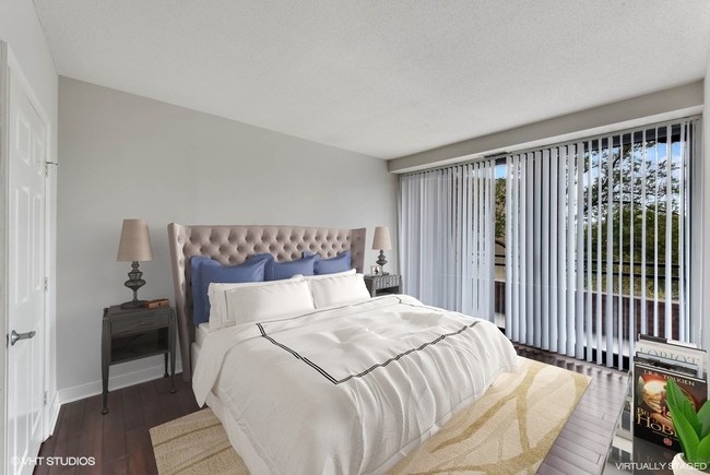 Primary Bedroom with Oversized Windows - The Saratoga Apartments