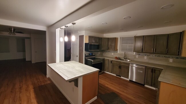 Kitchen from Dining Room island lighting - 603 E Atlantic Ave