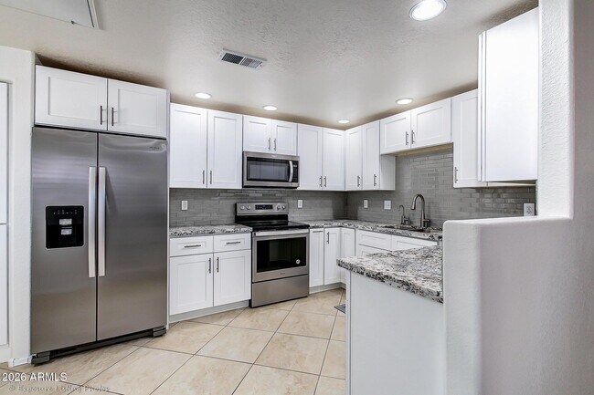 Building Photo - 9555 E Raintree Dr