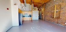 Step into a world where historic charm meets contemporary elegance. This extraordinary 780 sq ft loft in Lawrence, MA, is a canvas for your dreams, offering a lifestyle that's both sophisticated and inspiring. The moment you enter, you're greeted by soaring ceilings and exposed brick walls that whisper tales of the building's rich industrial past.

The heart of this home is a chef's dream kitchen, boasting warm honey-toned cabinetry that contrasts beautifully with sleek stainless steel appliances. The blue glass backsplash adds a pop of color, reminiscent of the nearby Merrimack River. Ample counter space and modern fixtures make meal preparation a joy, whether you're whipping up a quick breakfast or hosting a gourmet dinner party.

The spa-like bathroom is a serene retreat, featuring a stylish vanity with granite countertops and a spacious tub/shower combination. The clean lines and neutral palette create a calming atmosphere, perfect for unwinding after a long day.

The open floor plan allows for limitless possibilities. Whether you envision a cozy living area, a home office, or an artist's studio, this versatile space adapts to your lifestyle. Original wooden beams and columns add character, while the abundance of natural light from large windows creates an airy, uplifting ambiance.

This loft isn't just a home; it's a statement of personal style and a launchpad for your urban adventures. Located in the heart of Lawrence, you're steps away from vibrant cultural scenes, diverse dining options, and the city's rich history. Embrace the opportunity to live in a space that inspires creativity, fosters relaxation, and elevates your everyday experiences.