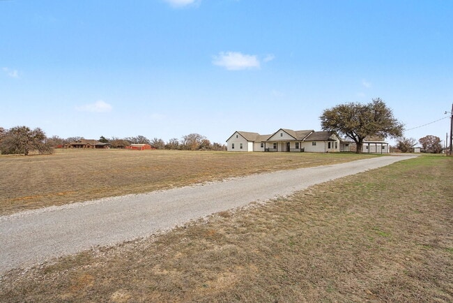 Building Photo - “4-Bedroom, 3-Bath Farmhouse Charm Meets Modern Luxury on a Serene 5-Acre Lot!”