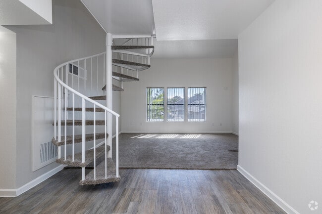 1BR, 1.5BA - 737SF - Living Room - Cambridge Village Apartments