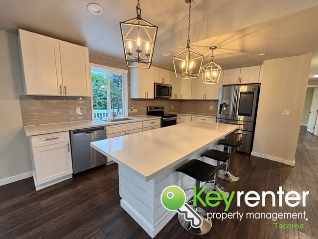 Building Photo - Split level 3 Bed 2 Bath Upstairs Unit with Modern Upgrades Close to JBLM!