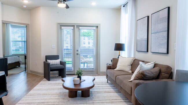 The Opal: 1BR, 1BA- Living Room - The Waters at Bluebonnet