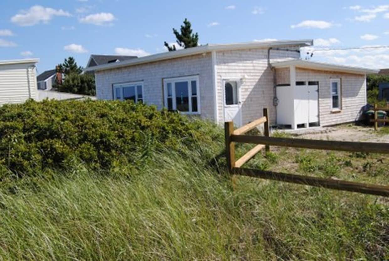 The house sits behind a sand dune, 5' above beach level. - 11 Gilbert St
