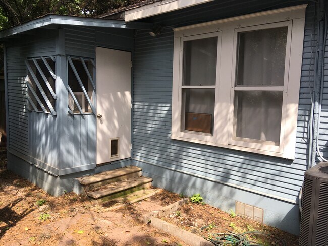 Back door, screened in porch includes a washer and dryer. - 4302 Duval Street