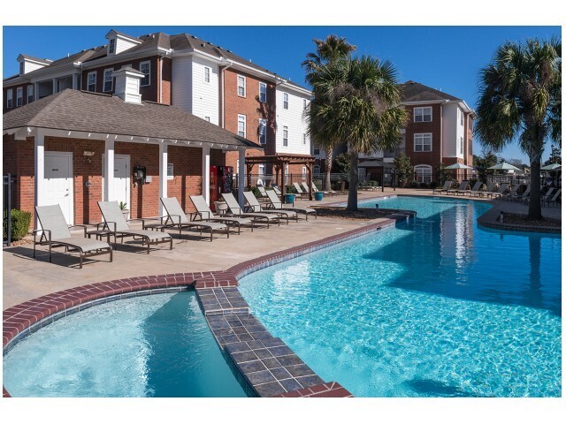 Relax and unwind by the resort-style pool at The Quarters, your perfect off-campus housing near UL Lafayette. - The Quarters