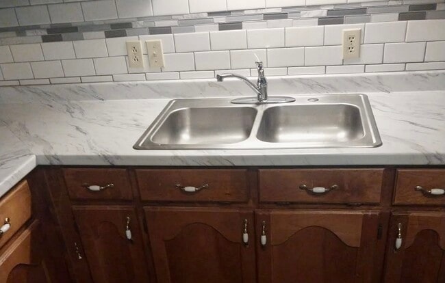 These are the new countertops in the unit. - 511 Banks Rd