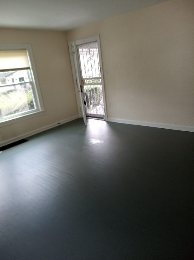 Living Room. High security storm door & entrance door with 2 lock sets. - 2051 Parkhill Dr