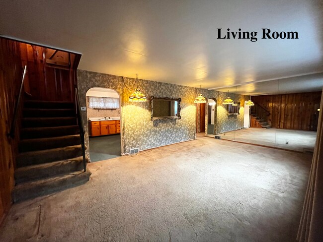 Covered stoop leads into a large (13*21) carpeted living room - 35 McGovern Blvd
