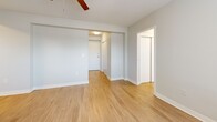Located at 917 Jefferson St in Kansas City, MO, this one-bedroom, one-bathroom unit offers a practical and well-organized layout on a single floor. The living room features warm hardwood-style flooring, a ceiling fan with light fixture, and a large window fitted with blinds that allows natural light to fill the space. A baseboard heating unit and window air conditioner provide year-round climate control. The kitchen is efficiently laid out and connects seamlessly to the main living area, making the most of the available footprint. Hallways connect the living spaces to the private areas of the unit, with two closets offering ample storage. The bedroom is carpeted for comfort, features its own ceiling fan, and includes a window with a baseboard heater beneath it, creating a cozy and well-lit retreat. A dedicated closet is accessible directly from the bedroom. The bathroom is clean and bright, showcasing classic blue mosaic tile flooring, a full soaking tub with shower, a wall-mounted sink, and a window that brings in natural light. Neutral, light-toned walls throughout the unit create a cohesive and airy ambiance, making this a functional and comfortable home in the heart of Kansas City.