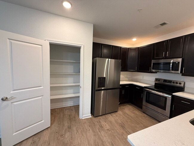 Building Photo - Beautiful New Build Condo – Convenience Meets Comfort