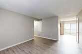 Located at 812 Fairview Dr in Lexington, NC, this single-floor, 2-bedroom, 2-bathroom home offers a practical and well-organized layout. The living room features neutral gray walls and durable hardwood-style flooring that extends throughout the main living areas, creating a clean and cohesive look. A hallway connects the living spaces to the bedrooms and bathrooms, ensuring a logical flow throughout the home.

The kitchen is equipped with warm oak cabinetry, light countertops, and black appliances including a range, refrigerator, and dishwasher. A sliding glass door brings in natural light and provides outdoor access directly from the kitchen.

Both bedrooms are carpeted for comfort and feature ceiling fans with integrated lighting. The primary bedroom includes a mirrored sliding-door closet and direct access to one of the two bathrooms. The second bedroom also benefits from natural light through a window with blinds and ample closet space. In total, the home includes four closets, offering generous storage throughout.

The bathrooms are finished with light hardwood-style flooring, white fixtures, and clean, simple cabinetry. A dedicated laundry area adds everyday convenience. Overall, the home presents a functional and tidy living environment suited for comfortable day-to-day living.