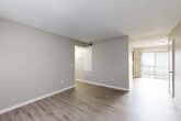 Located at 812 Fairview Dr in Lexington, NC, this single-floor, 2-bedroom, 2-bathroom home offers a practical and well-organized layout. The living room features neutral gray walls and durable hardwood-style flooring that extends throughout the main living areas, creating a clean and cohesive look. A hallway connects the living spaces to the bedrooms and bathrooms, ensuring a logical flow throughout the home.

The kitchen is equipped with warm oak cabinetry, light countertops, and black appliances including a range, refrigerator, and dishwasher. A sliding glass door brings in natural light and provides outdoor access directly from the kitchen.

Both bedrooms are carpeted for comfort and feature ceiling fans with integrated lighting. The primary bedroom includes a mirrored sliding-door closet and direct access to one of the two bathrooms. The second bedroom also benefits from natural light through a window with blinds and ample closet space. In total, the home includes four closets, offering generous storage throughout.

The bathrooms are finished with light hardwood-style flooring, white fixtures, and clean, simple cabinetry. A dedicated laundry area adds everyday convenience. Overall, the home presents a functional and tidy living environment suited for comfortable day-to-day living.