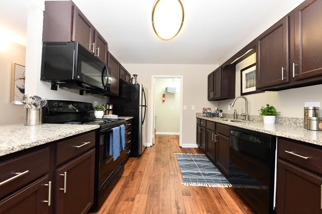 Kitchen with granite counters and modern cabinetry - Branchwater