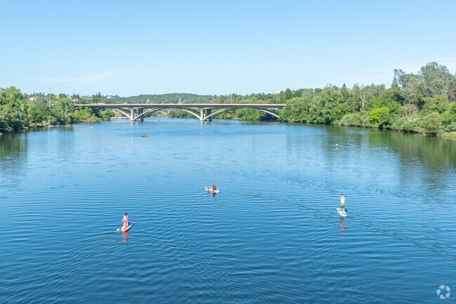 Paddleboard with friends at Black Miners Bar in Orangevale.