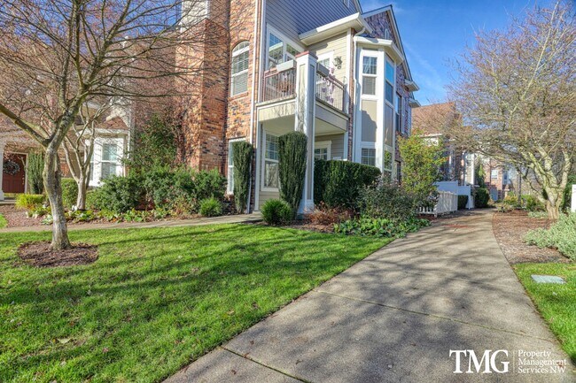 Foto del edificio - Spacious Ground-Level 2BD Condo with Garage & Resort-Style Amenities