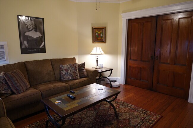 Living room with pocket doors closed. - 98 Woodland Ave.