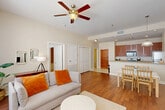 Located at 925 Common St in the heart of New Orleans, this well-appointed 2-bedroom, 3-bathroom residence offers a thoughtfully designed single-floor layout. The open-concept living, dining, and kitchen area serves as the central hub of the home, featuring warm hardwood flooring, recessed lighting, and a ceiling fan. Large windows flood the living room with natural light, creating a bright and welcoming ambiance.

The kitchen is equipped with stainless steel appliances, rich wood cabinetry, granite-style countertops, and a peninsula that transitions seamlessly into the dining area — ideal for both casual meals and entertaining. Tile flooring in the kitchen adds a practical contrast to the hardwood found throughout the living spaces.

Both bedrooms are generously sized, each benefiting from multiple windows with blinds for adjustable light control. The primary bedroom includes a walk-in closet with wire shelving. Each bedroom is paired with its own full bathroom, featuring granite vanities, tile flooring, soaking tubs, and tub-shower combinations with stone-surround tile. A third bathroom provides added convenience for guests.

Additional highlights include a dedicated laundry area, two closets for ample storage, and a well-organized layout that maximizes functionality throughout.