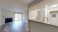 Located at 99 Antelope Way in Worthington, Ohio, this single-floor residence offers a clean, modern aesthetic throughout its thoughtfully designed layout. The open-concept living and dining area is bright and inviting, featuring warm hardwood-style flooring, neutral walls, and a large sliding glass door that opens to a private balcony overlooking a natural wooded backdrop, allowing for generous natural light and serene outdoor views. A secondary window further enhances the sense of openness in the living space.

The kitchen is efficiently designed with white shaker-style cabinetry, granite-look countertops, a peninsula with an undermount sink, and stainless steel appliances including a range and refrigerator. The layout connects seamlessly to the main living area, making the space ideal for everyday functionality.

The bedroom is carpeted and comfortably sized, featuring a window with views of the surrounding trees, providing a quiet and restful environment. The bathroom is well-appointed with white cabinetry, a single-sink vanity with a solid-surface countertop, a large mirror, bright vanity lighting, and a tub-shower combination. Hardwood-style flooring continues through the bathroom, maintaining a consistent, cohesive design. Overall, the unit presents a fresh, updated feel throughout.