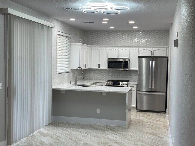 Building Photo - **GORGEOUSLY REMODELED & CLEAN!!  3BD-2 1/2BA HOME IN SILVERADO RANCH !!  *** ONLY $2,190 ***