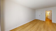 This 620 square foot apartment in San Clemente offers a thoughtful layout maximizing its compact footprint. The space boasts a modern aesthetic with crisp white walls and warm wood flooring throughout, creating a bright and inviting atmosphere.

The kitchen is a standout feature, showcasing sleek white cabinetry, marble-like countertops, and stainless steel appliances. It's efficiently designed with ample storage and counter space, perfect for culinary enthusiasts. The living area flows seamlessly from the kitchen, offering a versatile space for relaxation and entertainment.

The bedroom, measuring 160 square feet, is well-proportioned with a large window allowing natural light to flood in. A ceiling fan adds both style and functionality. The bathroom impresses with its modern fixtures, including a glass-enclosed shower, stylish vanity, and contemporary lighting.

Throughout the apartment, recessed lighting and strategically placed windows enhance the sense of space and light. The property's single-floor layout ensures easy accessibility, while its location in San Clemente promises a desirable coastal lifestyle. This apartment masterfully balances comfort, style, and efficiency in its compact design.