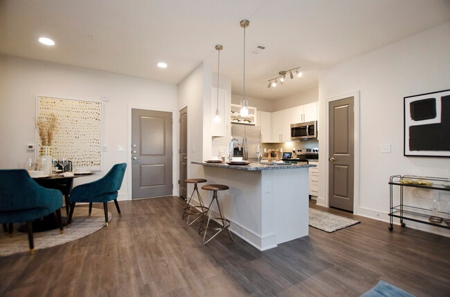 Kitchen and dining area with hard surface flooring - Avalon Frisco North