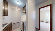 Located at 4545 Valley View Rd in Edina, MN, this one-bedroom, one-bathroom unit delivers a straightforward and functional single-floor layout spanning a comfortable total floor area. The space is organized to maximize usability, featuring a hallway entry that connects to the main living area, bedroom, bathroom, and closet.

The open living area is finished with neutral wall-to-wall carpeting, warm wood-toned baseboards, and a textured ceiling. Ceiling fans with integrated light fixtures are present in both the living area and bedroom, providing both air circulation and ambient lighting. Windows allow natural light to filter in, with views of the surrounding greenery. A wall-mounted HVAC unit and baseboard heating ensure year-round climate control.

The bedroom is generously proportioned, featuring the same soft carpeting, a ceiling fan, and a dedicated closet with built-in shelving for ample storage. A wood-panel door adds a classic touch to the room's interior.

The full bathroom is clean and efficient, featuring white square tile surrounding a full soaking tub with shower, mosaic tile flooring, and classic chrome fixtures.

Overall, this unit offers a practical and well-maintained living space in a convenient Edina location, suitable for those seeking simplicity and comfort.