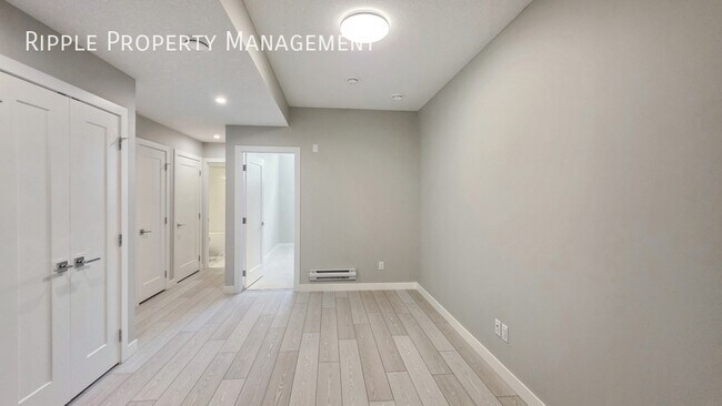 Photo du bâtiment - BRAND NEW 1 BED, 1 BATH BASEMENT SUITE | NEVER LIVED IN & MODERN FINISHES