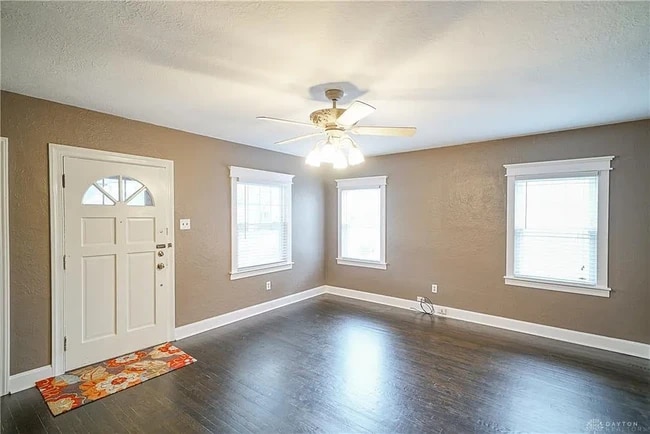 Living room--original hardwood floors, updated Thermopane windows - 703 N Central Ave