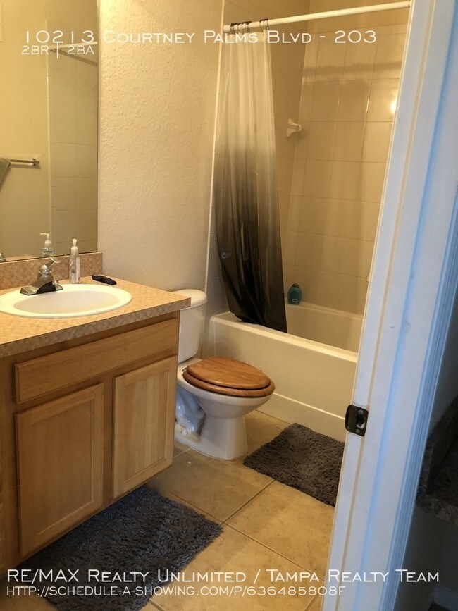 Building Photo - 10213 Courtney Palms BLvd #203