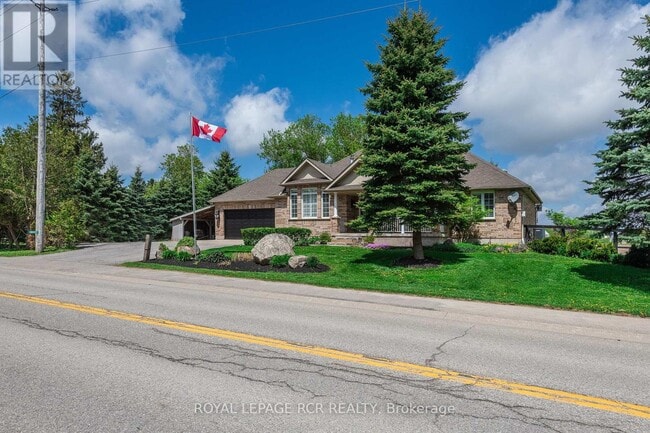 Photo du bâtiment - 285017 County Rd 10