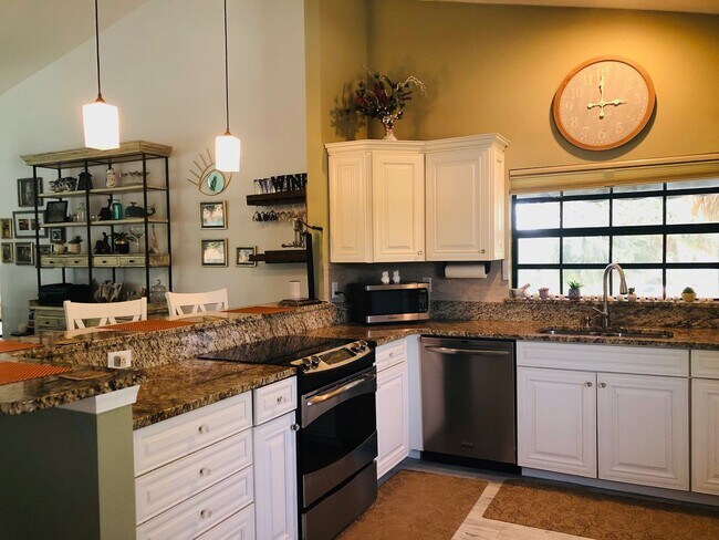 Building Photo - Experience the Gated Waterfront Community,...