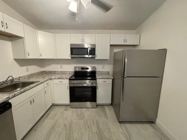 Building Photo - 6831 Tiki Ln