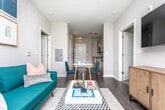Located at 811 Park St SW in Atlanta, Georgia, this single-floor residence offers a contemporary design with clean lines, neutral tones, and modern finishes throughout. The layout, as visible in the 3D overview, accommodates multiple bedrooms, a living area, kitchen, and bathrooms in a well-organized floor plan.

The kitchen is outfitted with light wood cabinetry, granite-style countertops, and a full suite of stainless steel appliances including an electric range, built-in microwave, and dishwasher. Wood-look flooring runs through the kitchen, complementing the modern aesthetic.

The living room benefits from multiple large windows that invite generous natural light and offer pleasant outdoor views of surrounding greenery. Dark hardwood-style flooring anchors the space, creating a warm, inviting atmosphere.

Each bedroom features plush carpeting, individual windows with views of the outdoors, and ample room for a full furniture arrangement including a bed and workspace. The bedrooms maintain a calm, neutral palette throughout.

The bathrooms are finished with granite-topped vanities, wood-tone cabinetry, and wood-look flooring. One bathroom includes direct access to a walk-in closet with built-in shelving, adding practical storage to the space. Overall, the residence presents a cohesive, modern aesthetic with functional, well-appointed spaces.